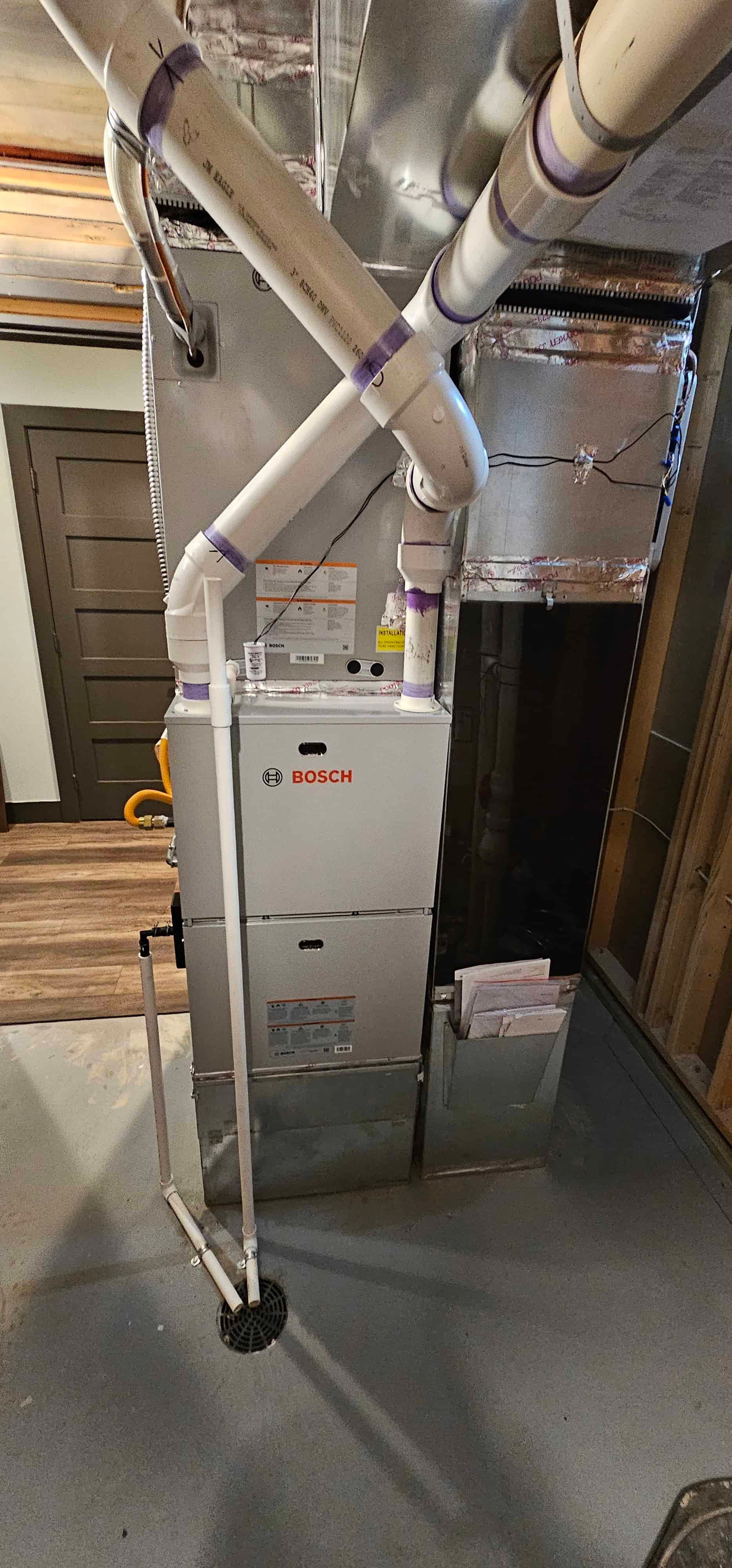 Bosch furnace and air handler connected to ductwork in a Denver basement
