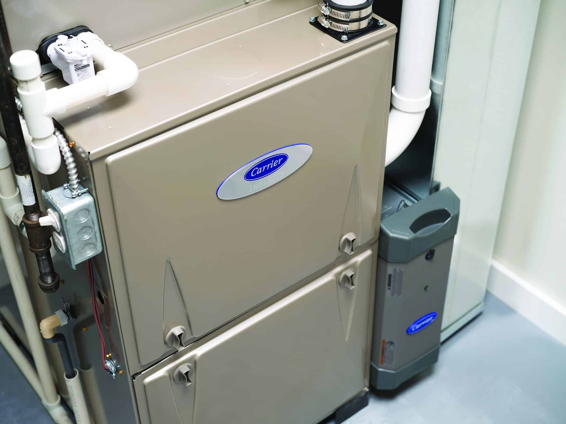Carrier Infinity high-efficiency furnace installed in utility closet