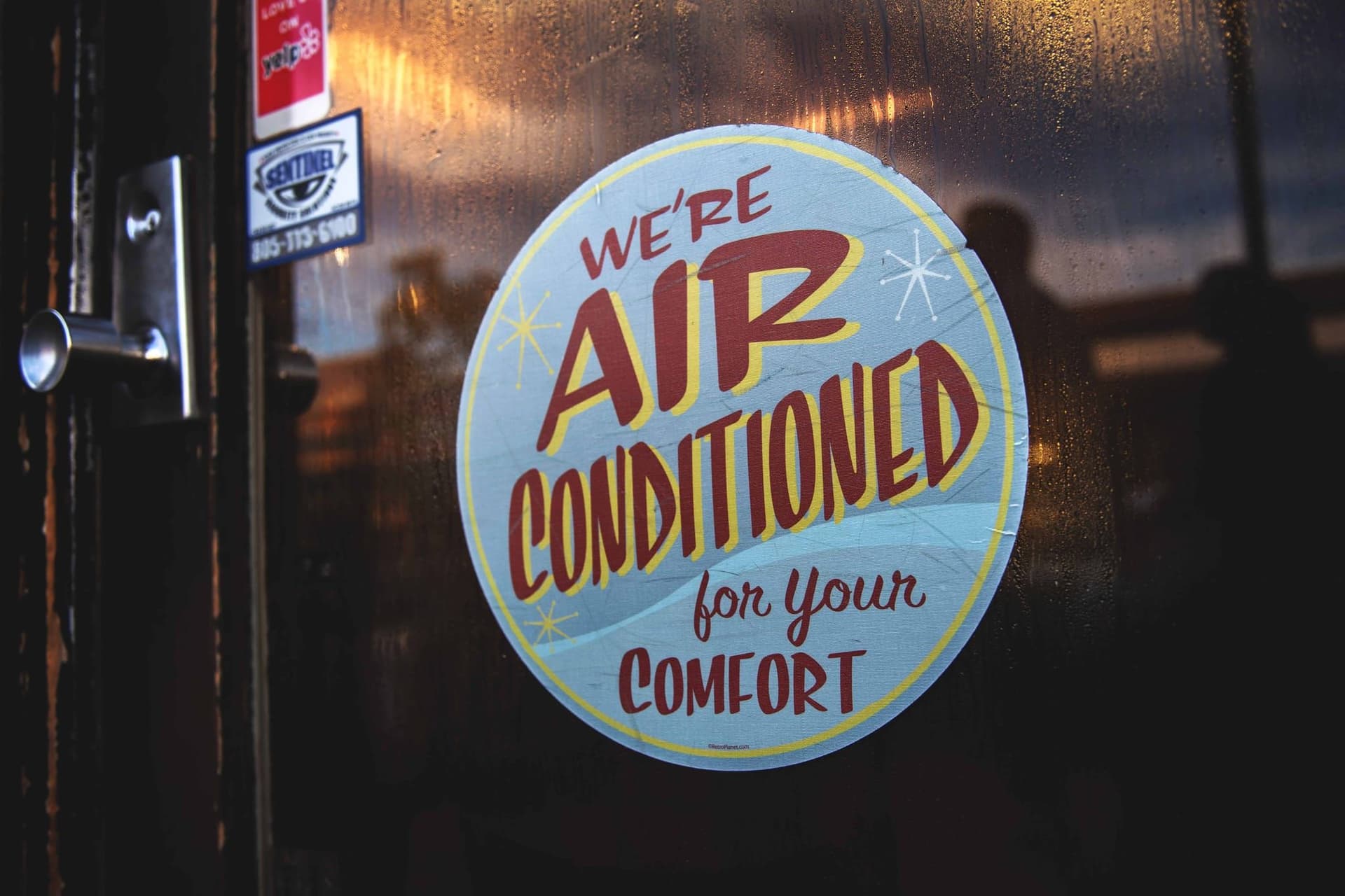 Air conditioning sign on door