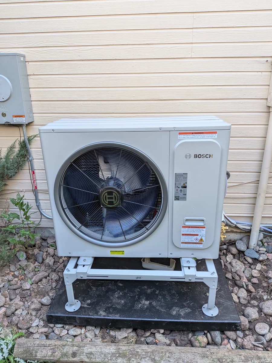 Bosch heat pump on a raised stand at a Parker home