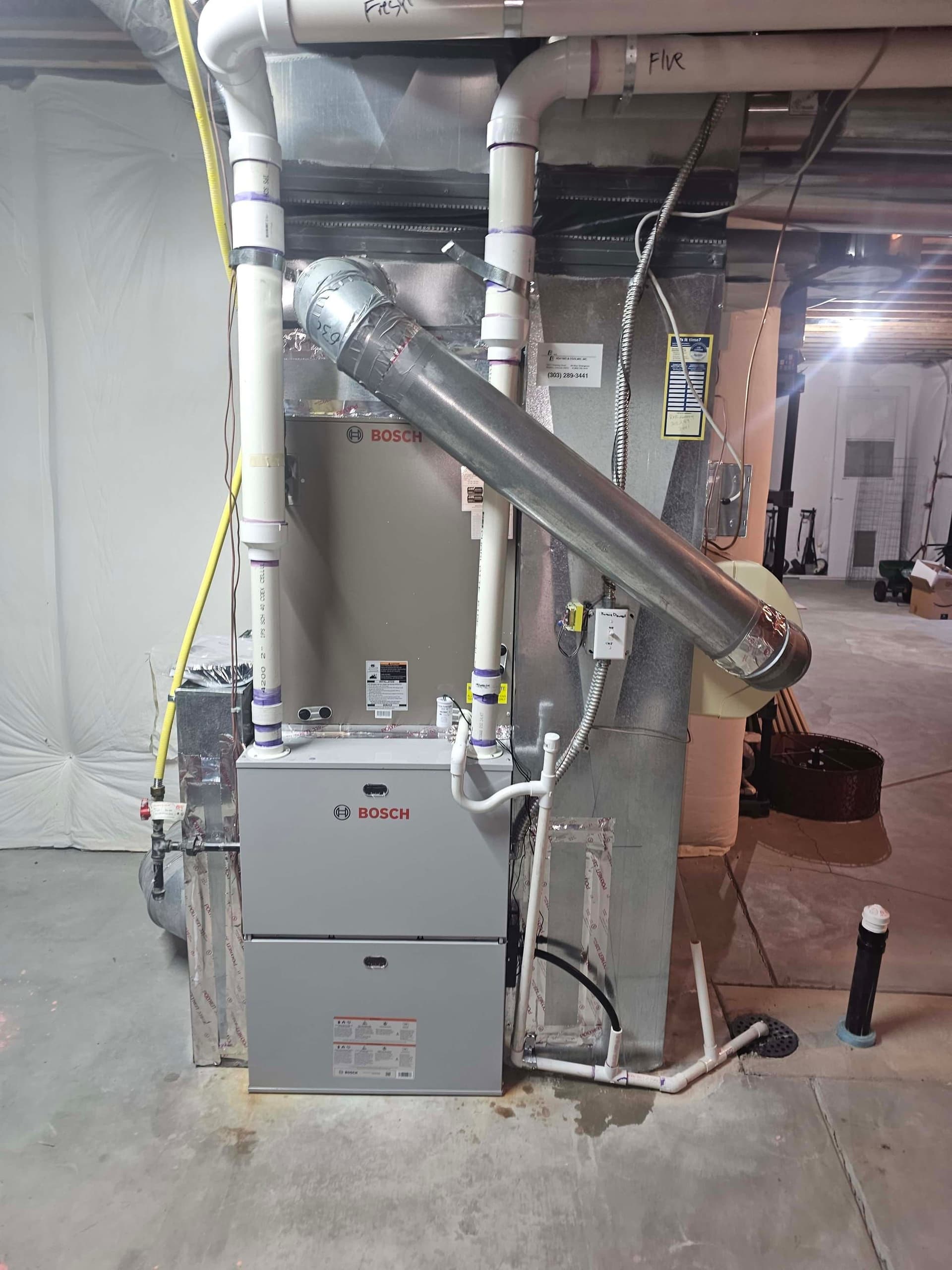 Bosch furnace and air handler in basement with tent barrier and pipes