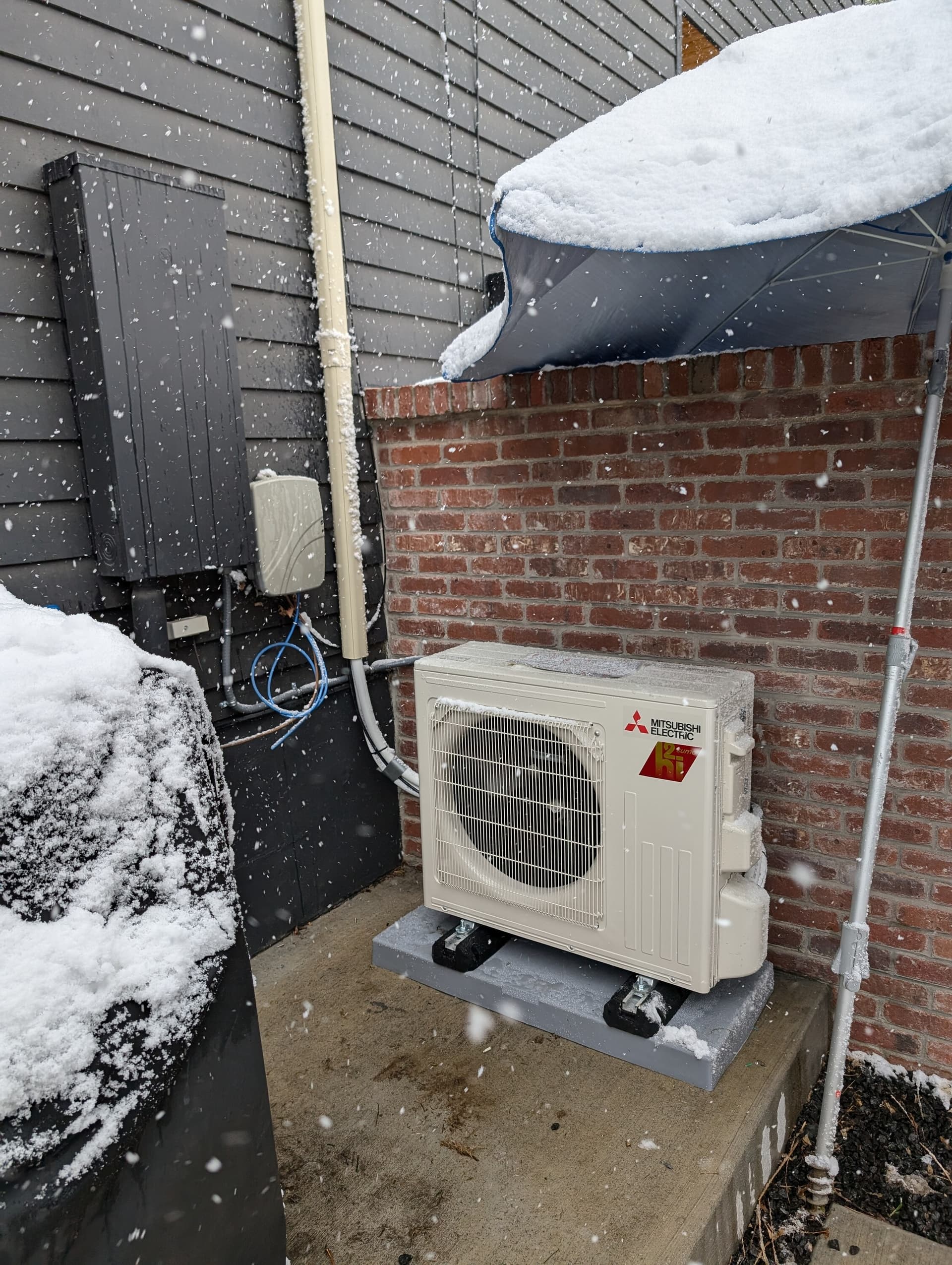 Mitsubishi heat pump, spring snow installed by UniColorado in the Denver area, April 2026