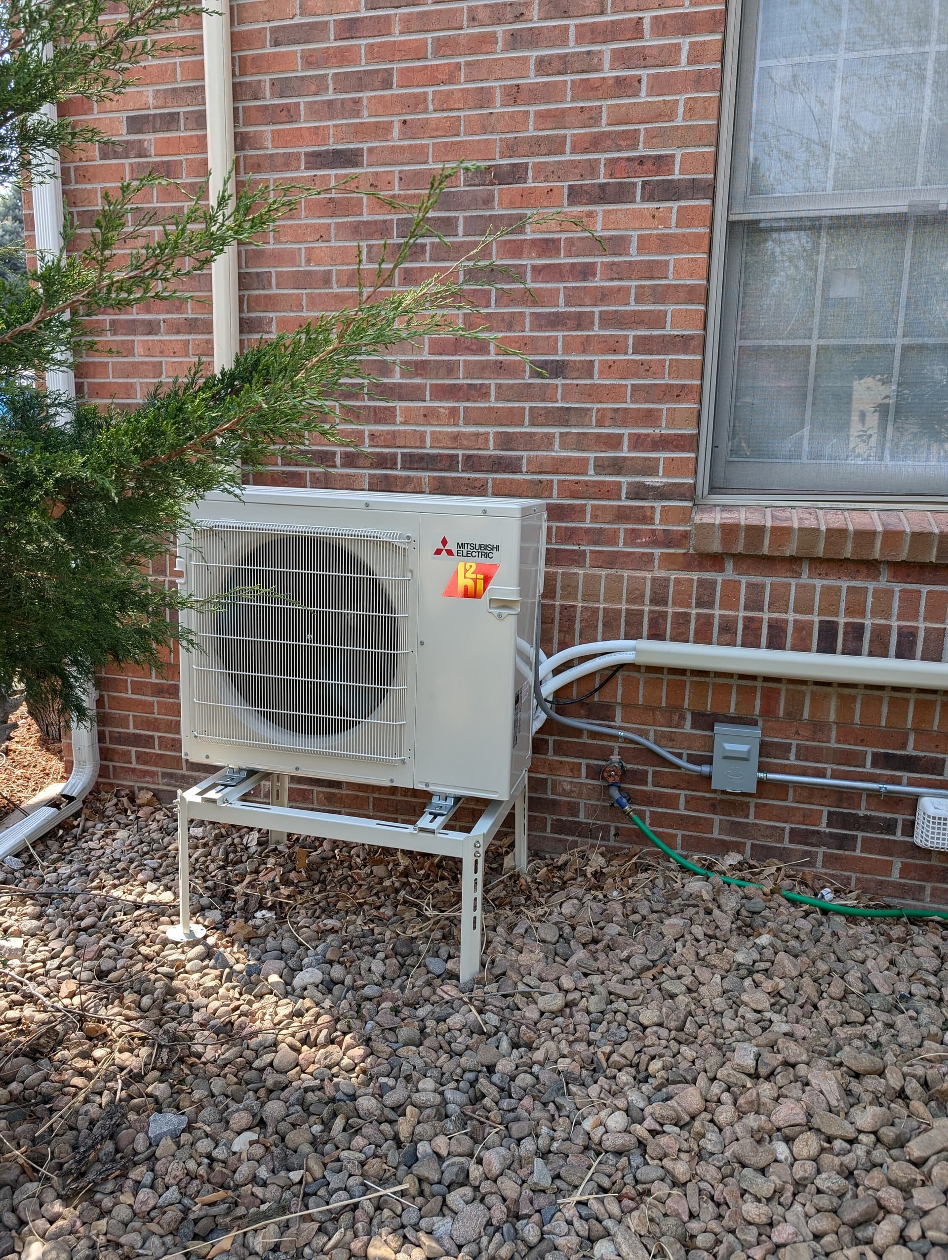 Mitsubishi heat pump on a stand installed by UniColorado in the Denver area, March 2026